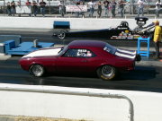 1967 MAROON CAMARO WITH WHITE RACING STRIPES